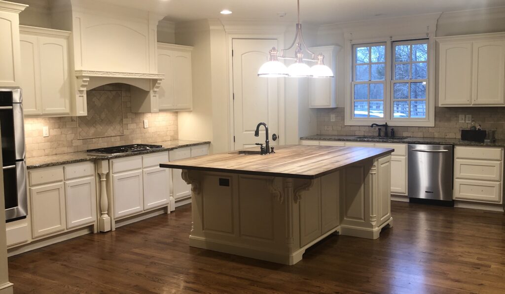 kitchen with butcher block, granite and travertine